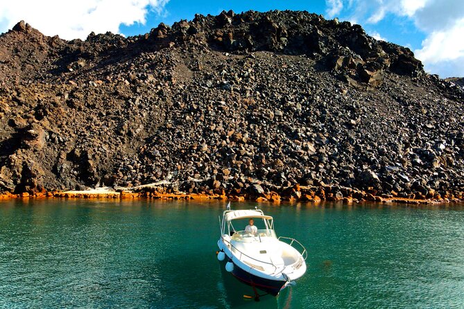 Explore Santorini and its volcanic wonders with Alex Private Boat - Thirassia time: clearer water, an easier mood, and music on board