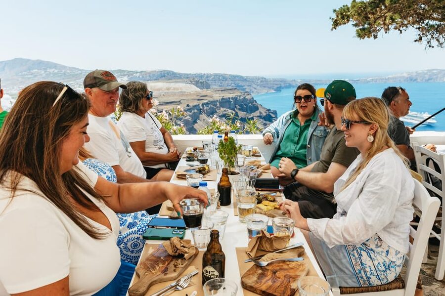 Fira: Guided Foodie Walking Tour with Tastings - Caldera-Edge Walking: Stunning Views With Uneven Ground Reality