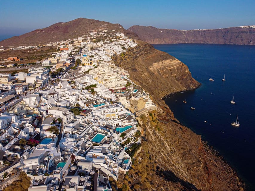 From Fira: Santorini Highlights Minibus Tour with Oia Sunset - Firostefani blue domes and the short walk to big views