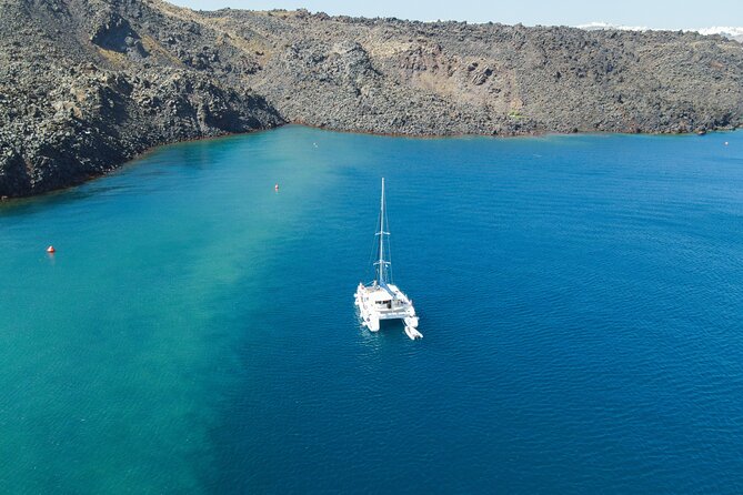 Full Day Santorini Catamaran Private Cruise with meal and transfer - Palea Kameni and Nea Kameni: volcanic islands and the hot springs effect