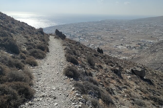 GreekAmerican guide Themistoklis to tour beautiful Santorini. - Black sand beach stops: the volcanic part of Santorini you can feel