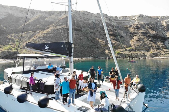 Half-Day Exclusive Catamaran Cruise in Santorini with Meal and Open Bar - Sunset Versions and the Reality of Watching from a Catamaran