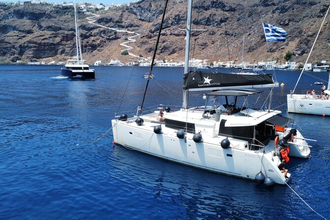 Half Day Premium Catamaran Cruise in Santorini including Oia - Premium catamaran, small-group vibe, and what the boat ride feels like