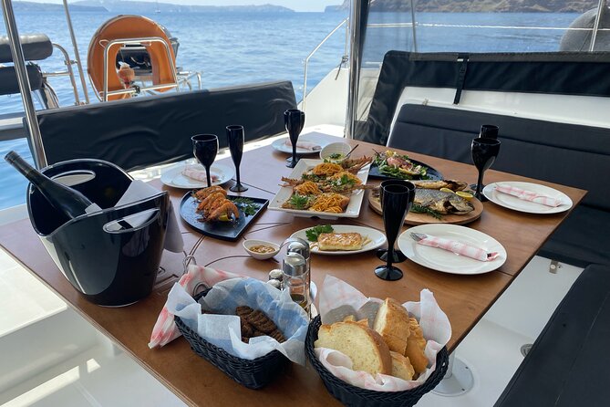 Half Day Premium Catamaran Cruise in Santorini including Oia - Volcanic hot springs at the Santorini Volcano stop: warm water and simple fun