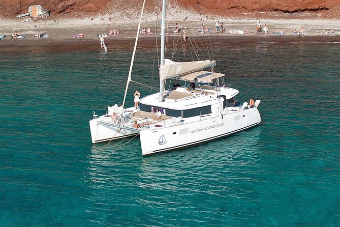 Luxury Santorini Catamaran Cruise: Lunch, BBQ, Drinks, Transfers - Mesa Pigadia Beach: your first real swim-and-snorkel break