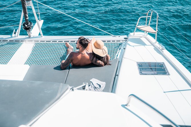 Majestic Catamaran Caldera Cruise with Snacks, Meal & Drinks - Red Beach photo time: a quick moment of drama