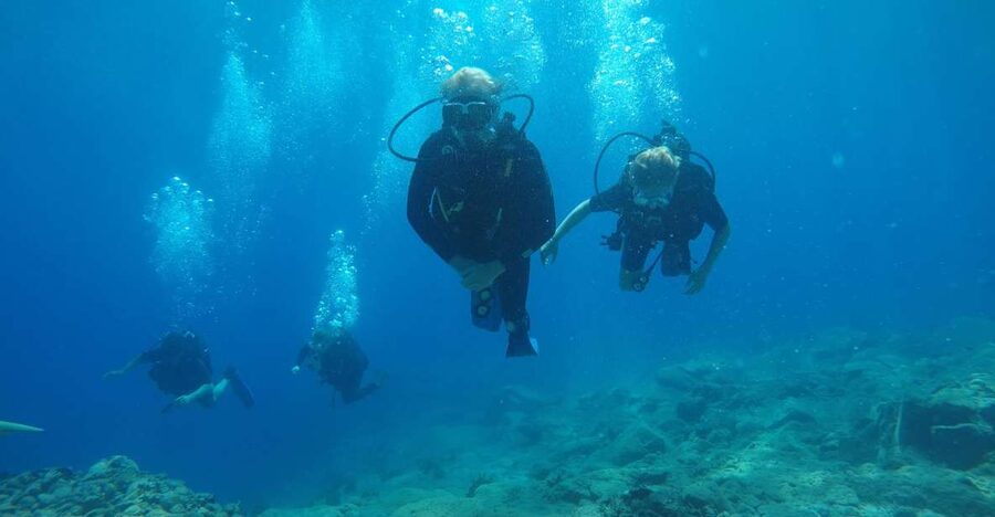 Oia: 2 Guided Scuba Dives off Santorini for Certified Divers - Getting to the water fast: bus, car, then speedboat
