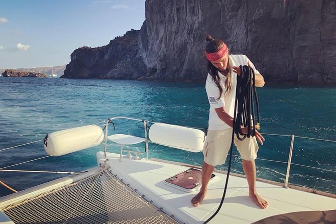 Premium Small-Group Catamaran Cruise with BBQ, Open Bar, Transfer - Sea-Level Caldera Views: Oia, Imerovigli, Firostefani, and the Venetian Lighthouse