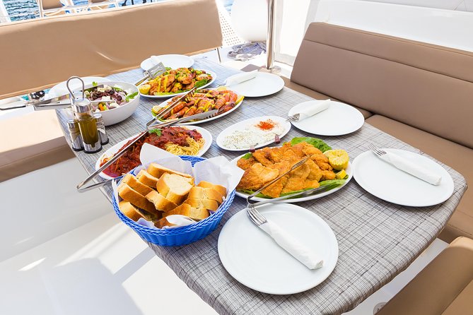 Premium Small-Group Catamaran Cruise with BBQ, Open Bar, Transfer - Thirasia and the Korfos Bay Area: Dramatic Caldera at a Slower Pace