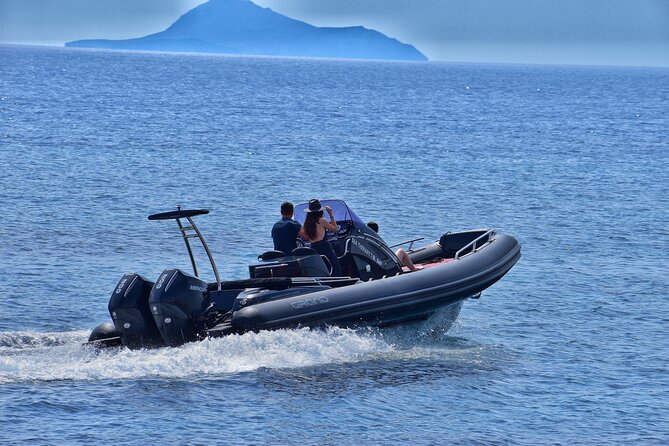 Private Boat Tour of Santorini - Mesa Pigadia and Black Rock: calm water meets the big volcanic monolith