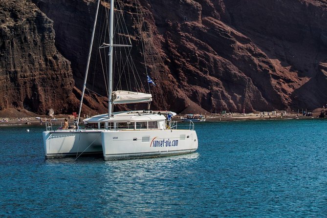 Private Morning Tour Lagoon 400-380 Sailing in Santorini ,lunch, drink, transfer - Old Lighthouse, Indian Rock, and the views you get only by sea