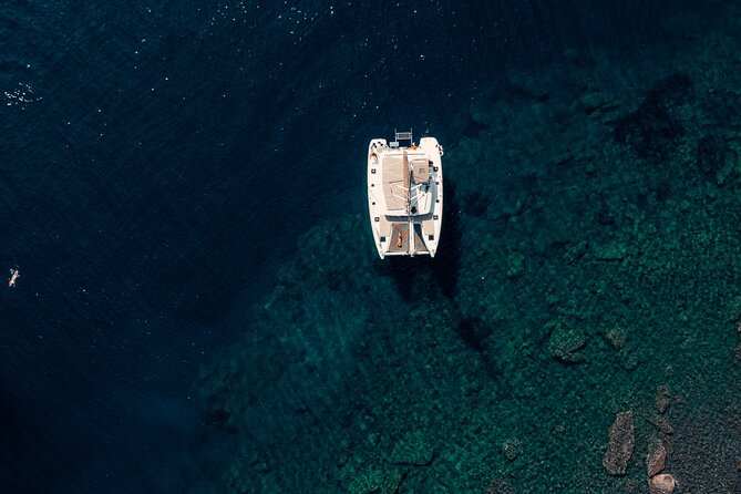 Romantic Sunset Catamaran Caldera Cruise incl. Meal & Drinks - Volcano caldera stop: hot springs water time and the temperature check