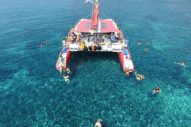Sailing Catamaran Cruise in Santorini with BBQ, Drinks and Transfer - Red Beach Stop: Colorful Water Time and Snorkeling