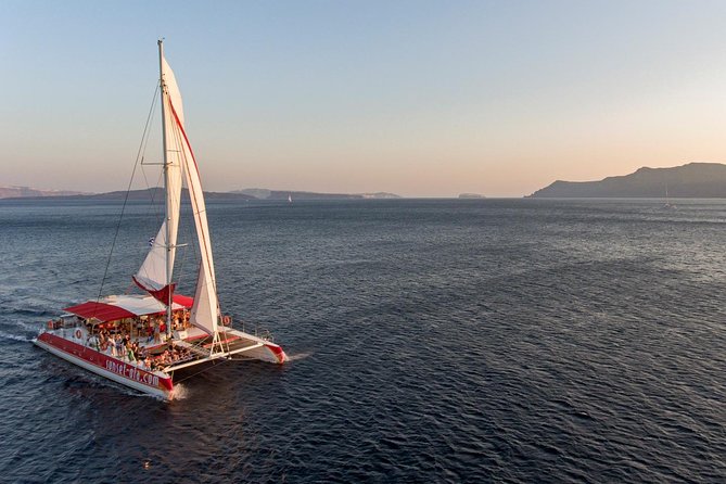Sailing Catamaran Cruise in Santorini with BBQ, Drinks and Transfer - Hot Springs Area Swim: Warmer Water Near the Volcano