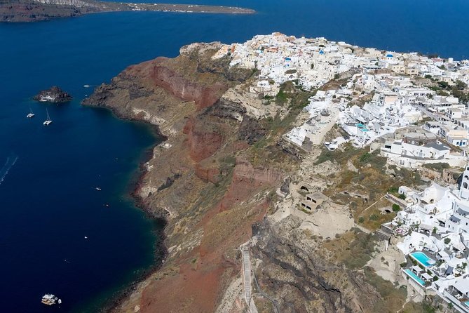 Santorini 30min Helicopter Tour - First ground stops: whitewashed villages on the volcanic rim