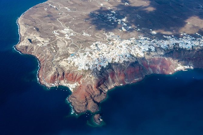 Santorini 30min Helicopter Tour - Perissa and Kamari: black sand and classic beach-town energy