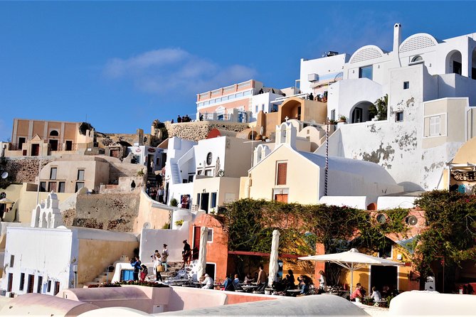 Santorini 5 Hour Private Oia Tour & Lunch/Dinner at a Local Farm - Oia Main Street with a local guide: views, blue domes, and real walking
