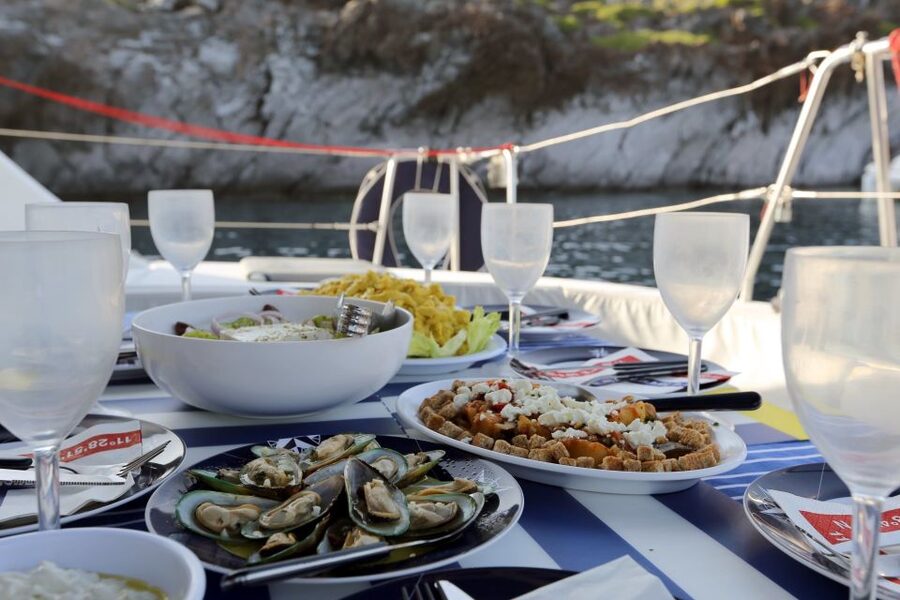Santorini: 7-Hour Private Catamaran Cruise with Food & Drink - What to bring (and what to pack extra well in Santorini sea wind)