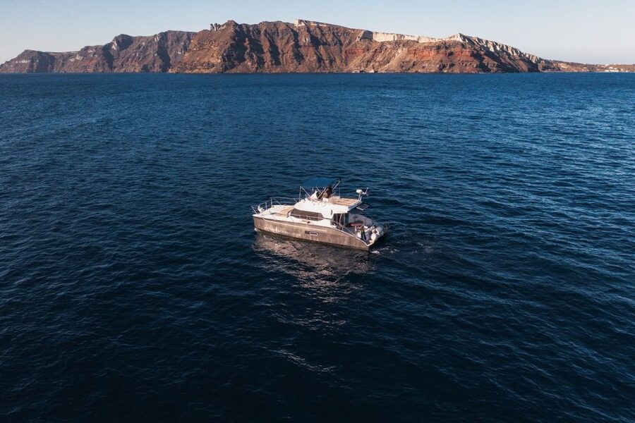 Santorini: Caldera Private Power Catamaran Cruise - Open bar, Wi‑Fi, and the water toys that change everything