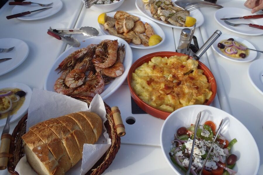 Santorini Caldera: Sunset Sailing Cruise with Meal - Swim and snorkel off Mesa Pigádia, then again near the volcano