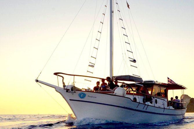 Santorini Caldera Sunset Traditional Cruise with Meal and Drinks - White Beach: The Private-By-Boat Look at Santorini’s Crystal Water