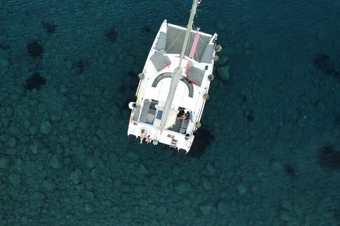 Santorini Catamaran Cruise – 5-Hour Private Sailing Experience - White Beach for snorkeling and a calmer vibe