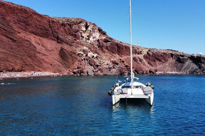 Santorini Catamaran Cruise – 5-Hour Private Sailing Experience - The Santorini volcano stop: seeing it close, learning as you go