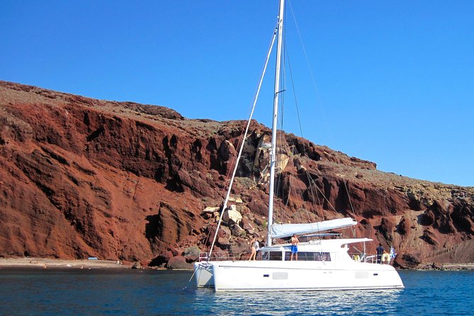 Santorini Catamaran Cruise with Fresh Meal and Open Bar - Akrotiri Lighthouse Views: Seeing the Caldera from the Waterline