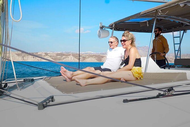 Santorini Catamaran Cruise with Greek Meal, Open-Bar and Sunset - Back along the south coast: White and Mesa Pigadia beaches