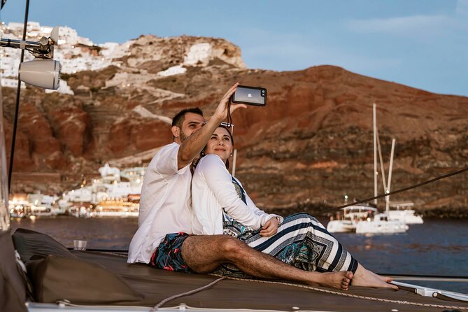 Santorini Catamaran Cruise with Greek Meal, Open-Bar and Sunset - Sunset option: watching the caldera fade from sea level