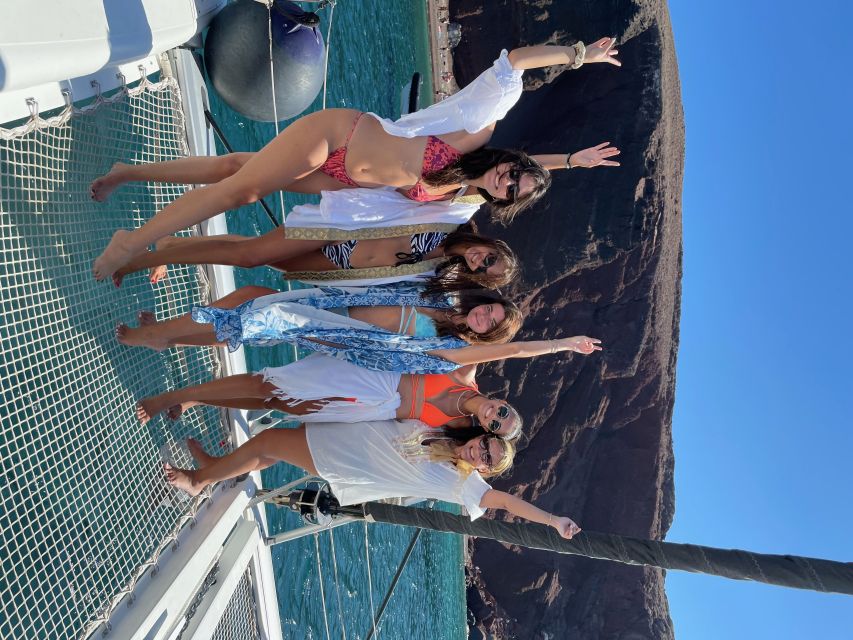 Santorini: Catamaran Cruise with Meal & Open Bar - White Beach, Black Beach, and the quick photo pass-by views