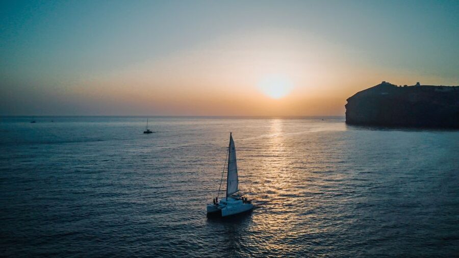 Santorini Catamaran Cruise with Swimming, Meal and Open Bar - Thirassia time for swimming, snorkeling, and a proper on-board meal