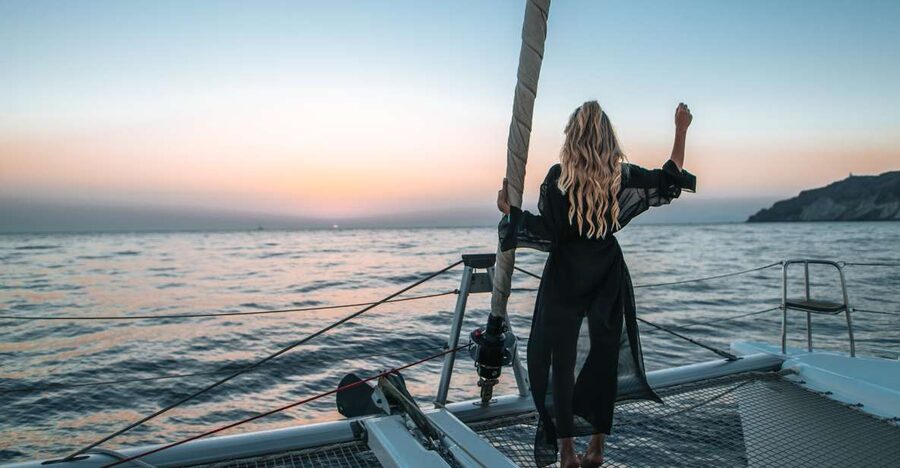 Santorini Catamaran Cruise with Swimming, Meal and Open Bar - Open bar, crew energy, and practical comfort at sea
