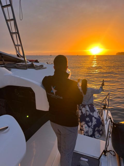 Santorini Catamaran Cruise with Swimming, Meal and Open Bar - From Vlychada to Red Beach and the Akrotiri Lighthouse pass-by