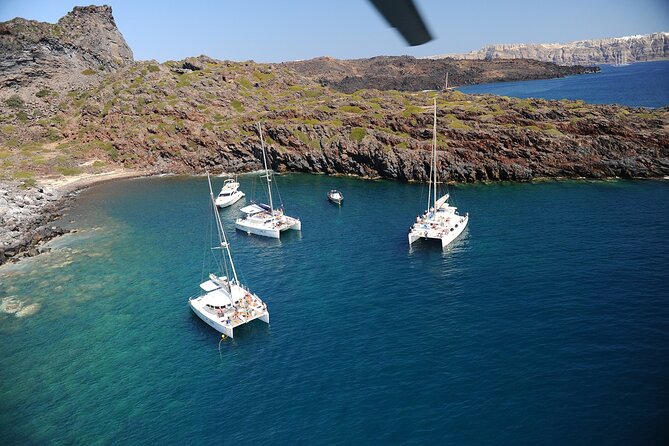 Santorini Classic Catamaran Cruise with BBQ, Drinks and Transfers - Palea Kameni hot springs: sulfur water, warm-up session