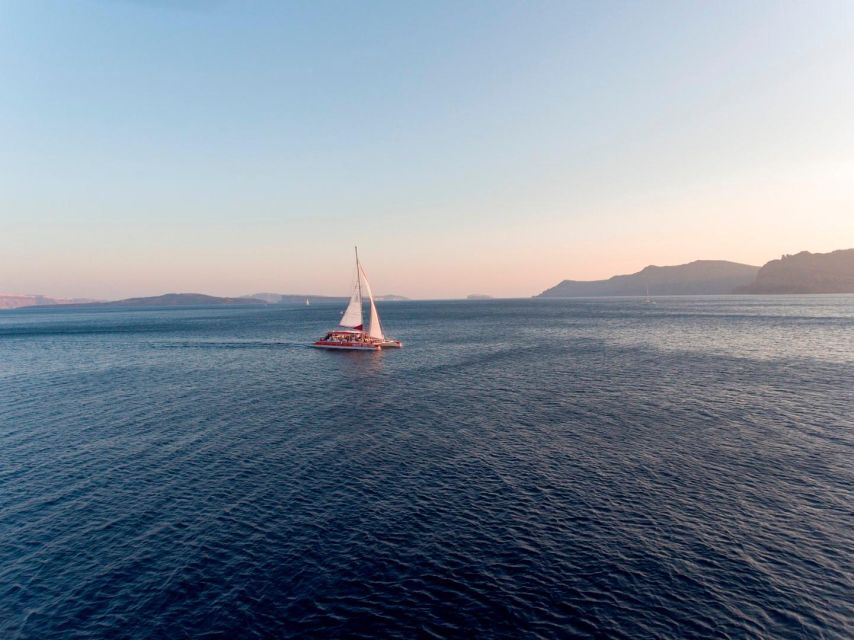Santorini: Cruise Catamaran with BBQ & Drinks Day or Sunset - A catamaran day in Santorini that feels built for real time