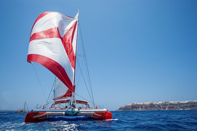Santorini Cruise on Catamaran with BBQ & Open Bar - White Beach and Lunch: Your Longest Stop, BBQ Time, and a Better Sea Rhythm