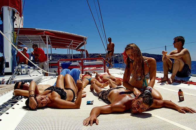 Santorini Cruise on Catamaran with BBQ & Open Bar - Getting to the Port: Hotel Pickup, Shoe Rules, and Your First Minutes Afloat