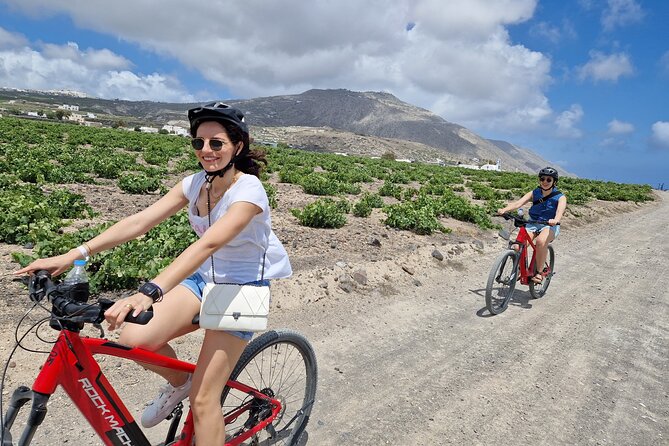 Santorini e-bike sunset tour experience - Vineyards and Santorini’s basket-pruned shape