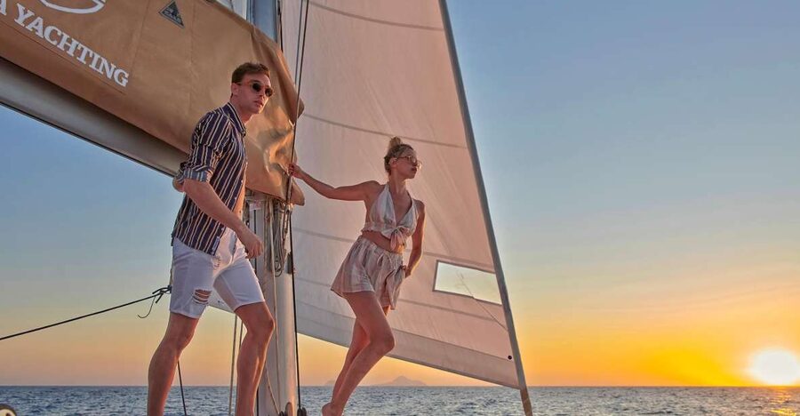 Santorini Gold Catamaran Cruise with Snorkel, BBQ & Open Bar - Stop 2: White Beach Views and the Venetian Lighthouse From the Water