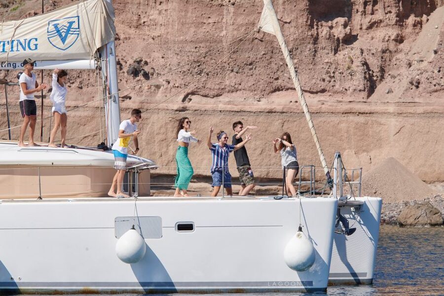 Santorini Gold Catamaran Cruise with Snorkel, BBQ & Open Bar - Stop 1: Red Beach Snorkeling Near the Iconic Red Cliffs
