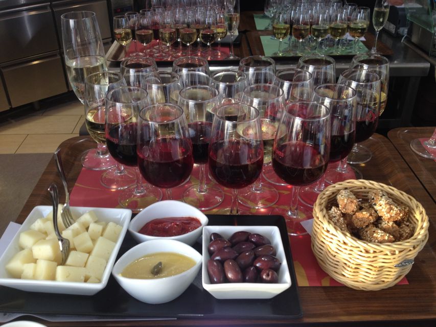 Santorini: Guided Tour to 3 Wineries with Wine Tastings - Stop 2: Art Space Winery for art, caves, and a different tasting mood