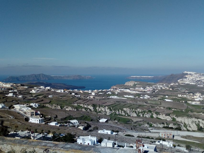 Santorini: Half-Day Sightseeing Tour with Hotel Pickup - Oia free time: shopping lanes, castle views, and how to handle crowds