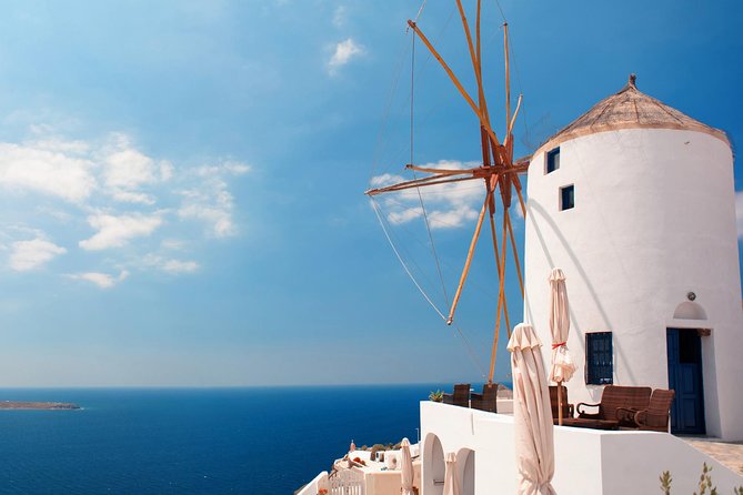 Santorini Highlights and Venetian Castles Small-Group Day Tour - Firostefani’s quick photo break: Blue Dome and the Rock of Skaros