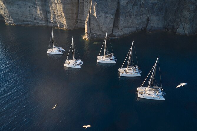 Santorini: Luxury Catamaran Cruise with Fresh Fish BBQ & Drinks - Nea Kameni: Longer Water Time and the Dinner Window