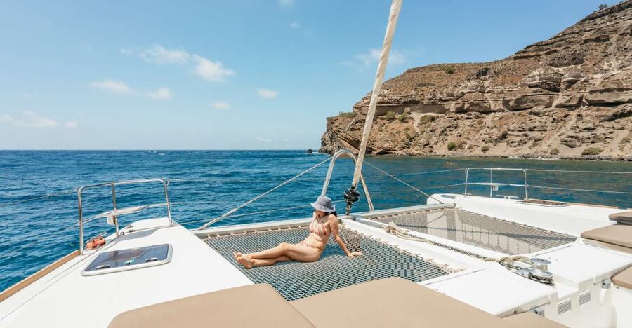 Santorini: Luxury Catamaran Day Trip with Meal and Open Bar - Key highlights at a glance