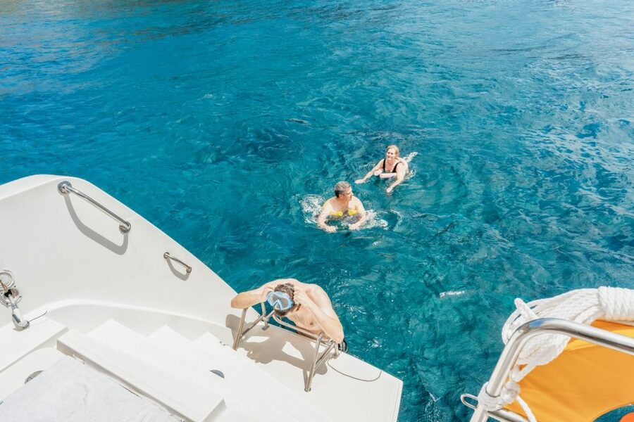 Santorini: Luxury Catamaran Day Trip with Meal and Open Bar - Photos, music, and the small comforts that keep you happy at sea