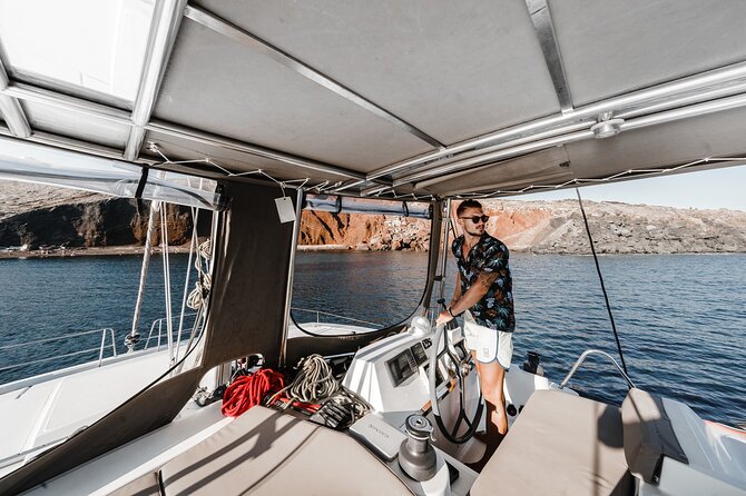 Santorini Luxury Catamaran Private Cruise - BBQ Dinner, Local Wine, and the On-Board Meal Vibe