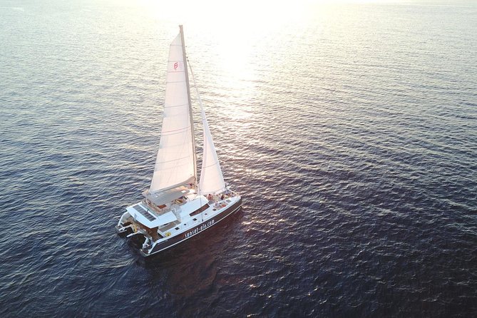 Santorini Luxury Catamaran Sunset Cruise with BBQ, Drink and Transfer - Aboard the Ipanema 58: where luxury shows up in real life