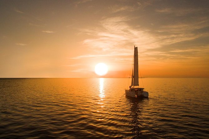 Santorini Luxury Catamaran Sunset Cruise with BBQ, Drink and Transfer - Red Beach and White Beach: snorkel time, swim rules, and the BBQ payoff